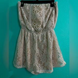 Strapless,beige, lace romper.Size medium in excellent condition only worn once.